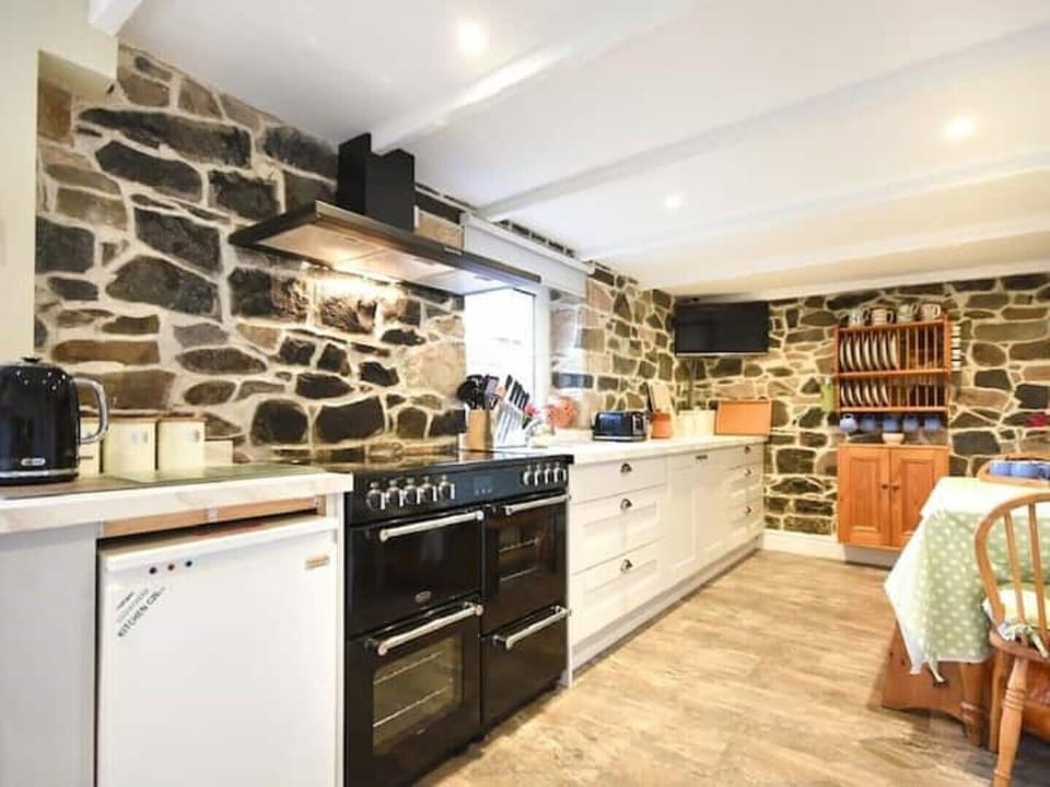 Large range oven and all the appliances and utensils you could need.