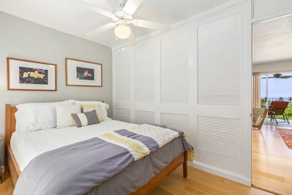 Guest Bedroom is separated from living room by shuttered door