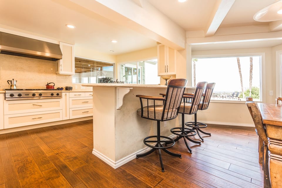 Kitchen island with high chairs for more seating options.