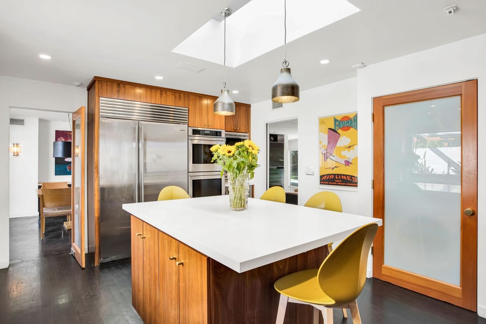 Sub-Zero refrigerator and a Monogram double-oven for an upscale kitchen experience.