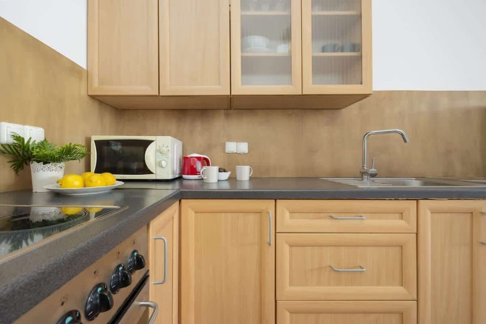 Another angle of the kitchen, showcasing additional storage space and a modern, functional design.

