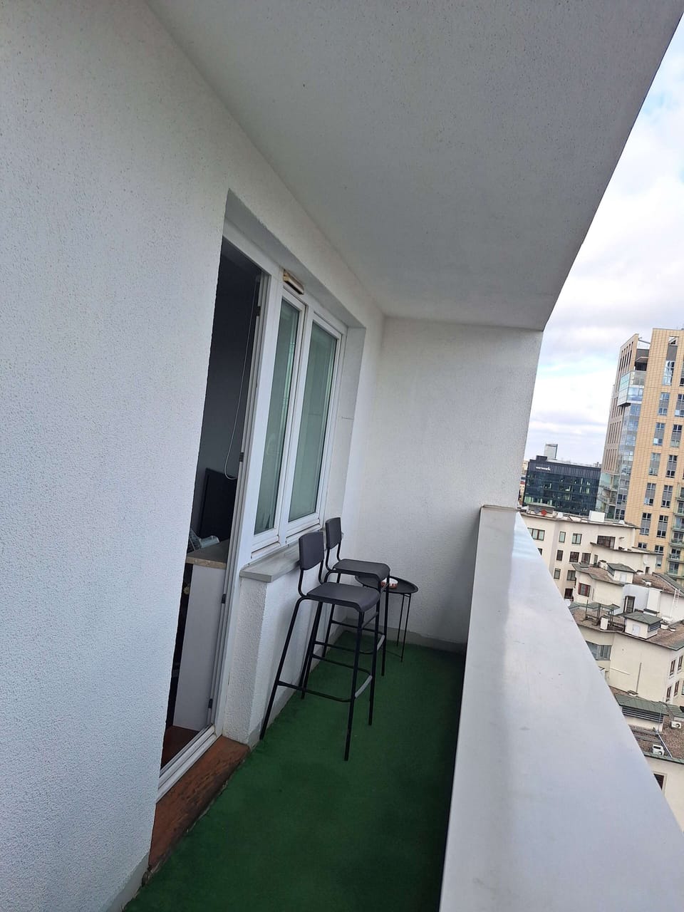 Elegant balcony with garden furniture.