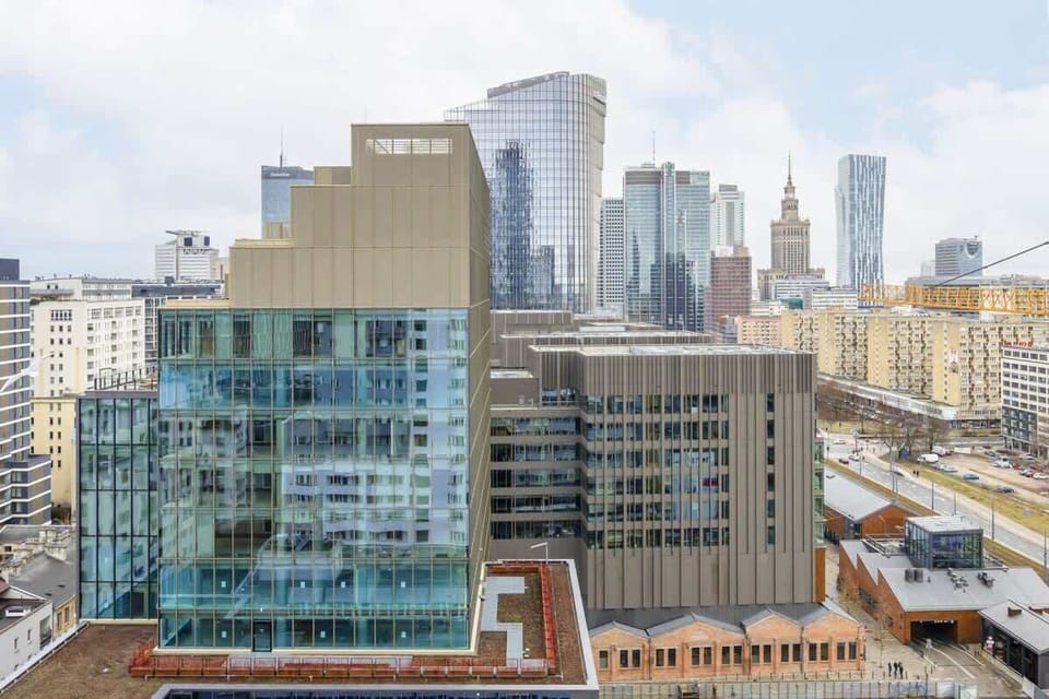 A breathtaking view of the city skyline from the apartment, showcasing modern skyscrapers and urban scenery.

