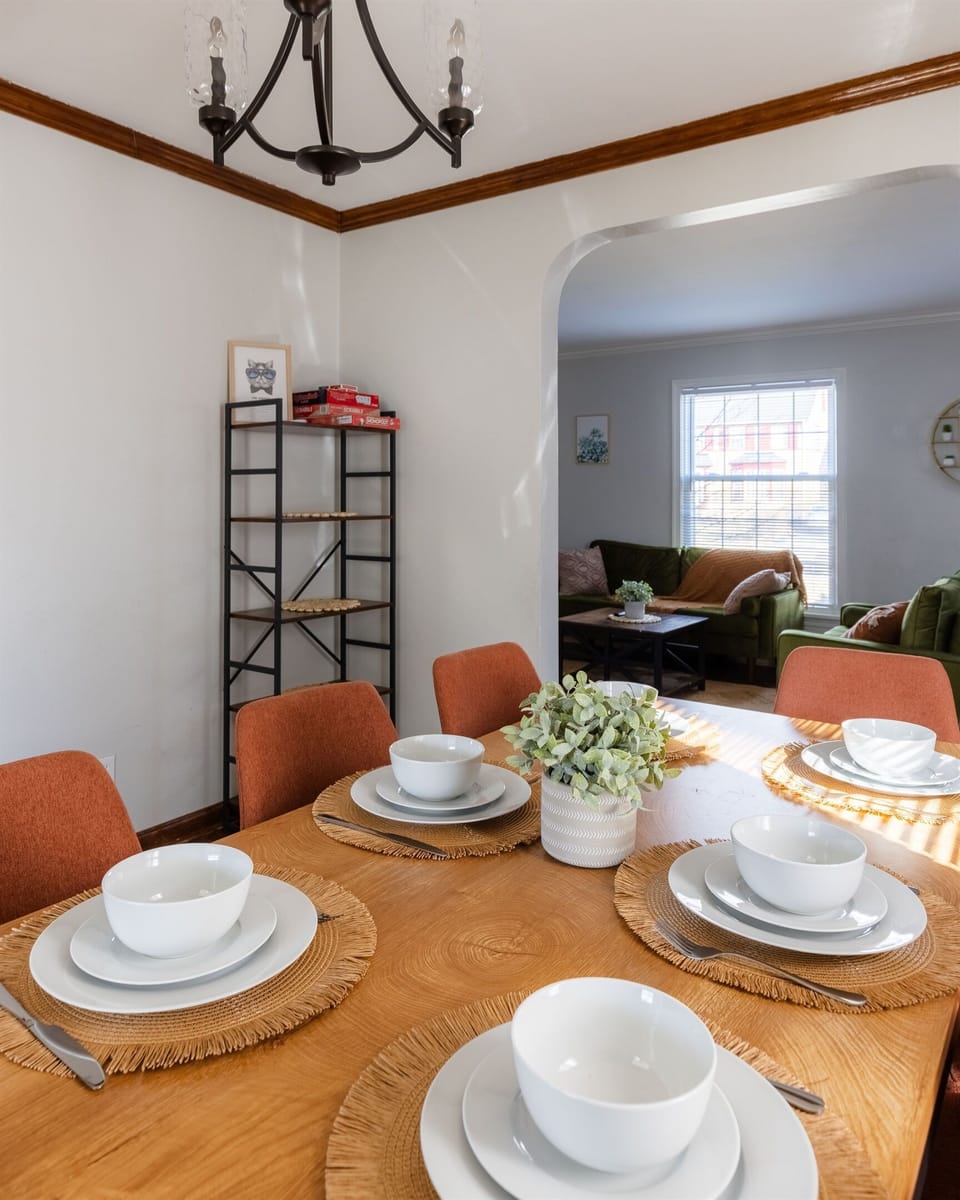 The generously sized dining space presents a warm and welcoming atmosphere