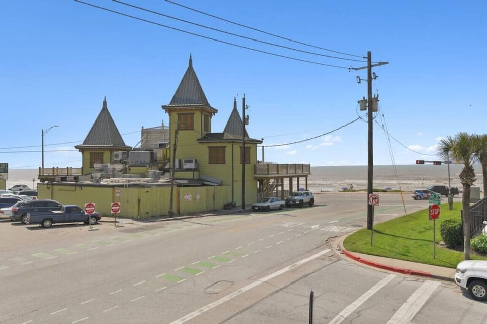 View of Beach from Front Corner of House | The Yellow Building is the Popular Local Restaurant, Miller`s Seawall Grill
