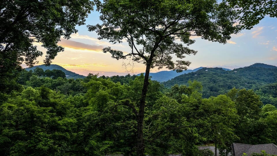 Enjoy a peaceful sunset over the mountains from your cabin's deck!