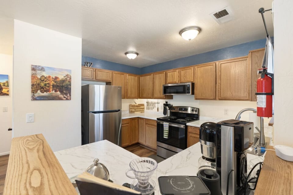 Chef’s kitchen with stainless appliances, quality finishes, and plenty of prep space.