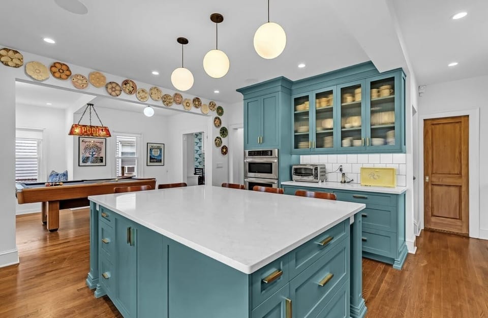 kitchen with view to pool table room
