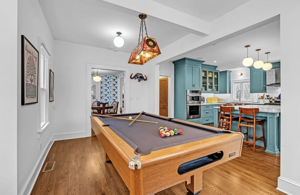 Pool table room with view of kitchen