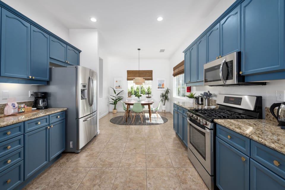 Large fully-stocked kitchen with breakfast nook.