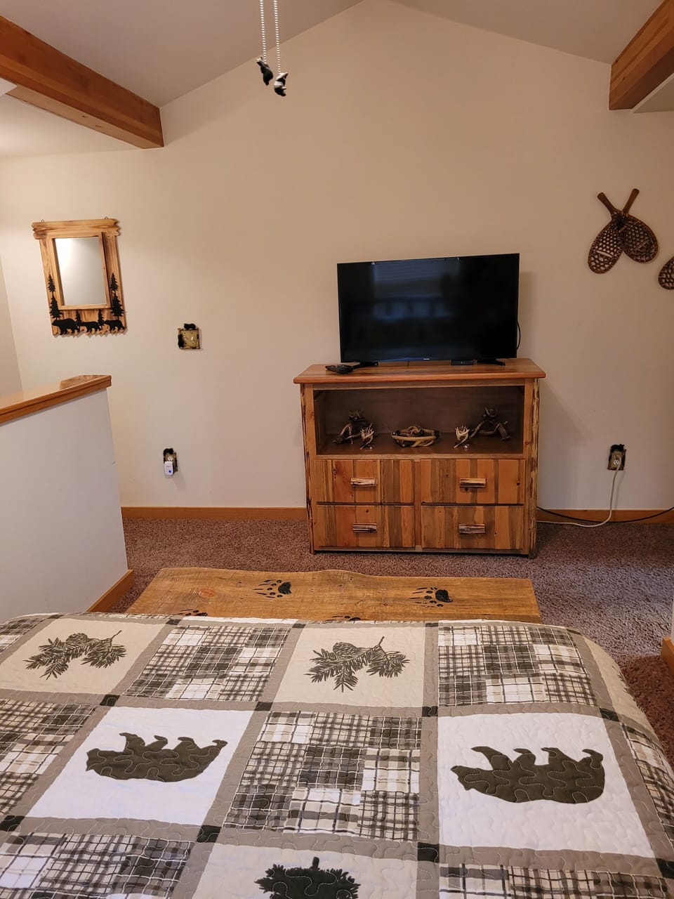 Queen size bed on upper floor with Air Conditioner and TV