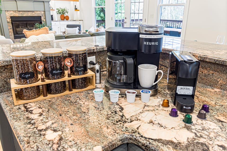 Three ways to brew your morning cup — the two-in-one Keurig handles K-cups or ground coffee, the Nespresso mini does espresso-style pods, and the grinder is ready for fresh whole beans.