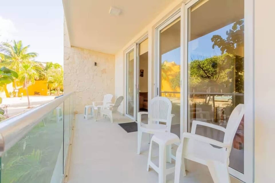 Feel the Caribbean breeze on the balcony accessible from bedroom or living room. 