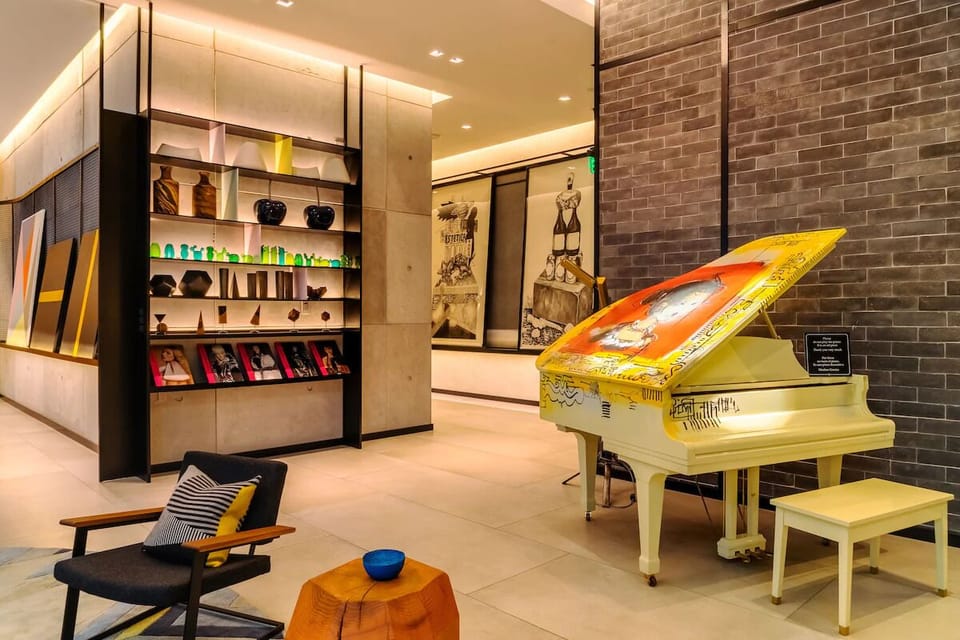 Play a few notes on the colorful grand piano.