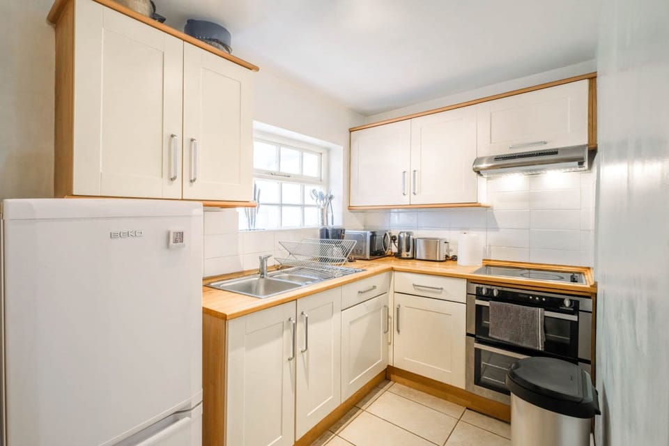 The kitchen is fully equipped to prepare a simple meal