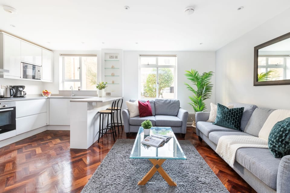 The open-plan living area and the kitchen