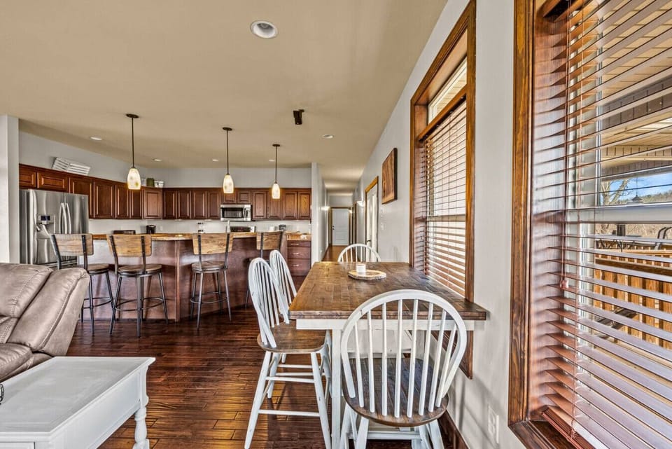 A dining table is conveniently located just off the living area with seating for four.