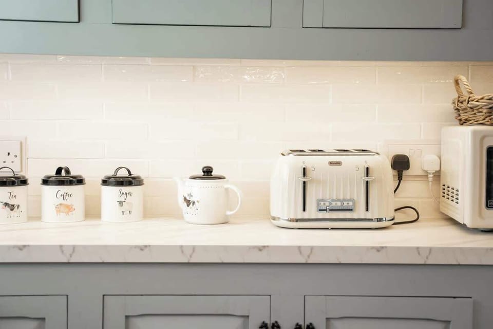 The Kitchen:  Original kitchen cabinetry painted with 'Duckling Al Fresco' Frenchic Paint