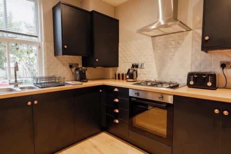 Kitchen: unleash your inner chef in our sleek kitchen with modern appliances and workspace.