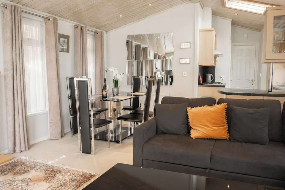 The Open Plan Living Space: enjoy a meal with your loved ones at the dining table in the spacious living area, perfect for making memories.