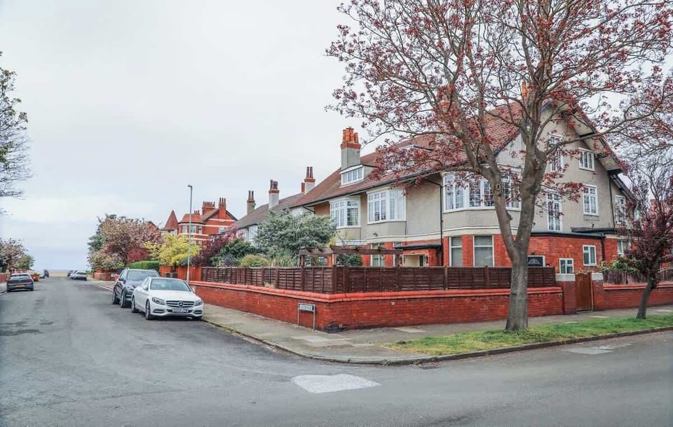 House View: the road view of the Edwardian maisonette with available parking and a tempting glimpse of the sea.