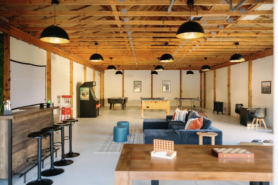 Game Garage: Spacious entertainment hub with games, comfy seating, and a projector for movie nights!