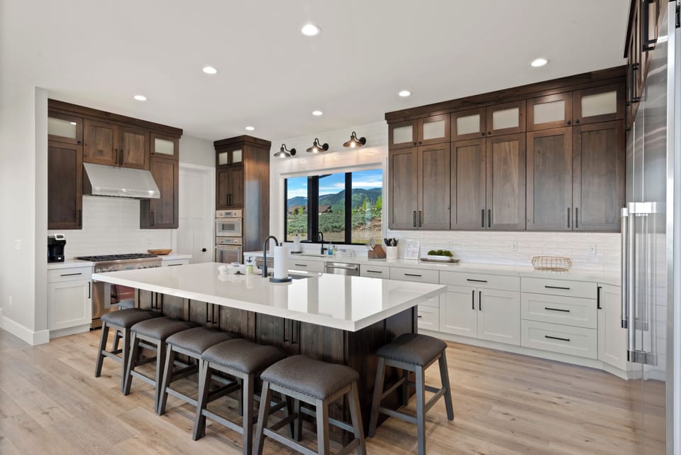 100 Acre Lodge-Kitchen Area with bar and seating for 9 (Main Floor West Center)
