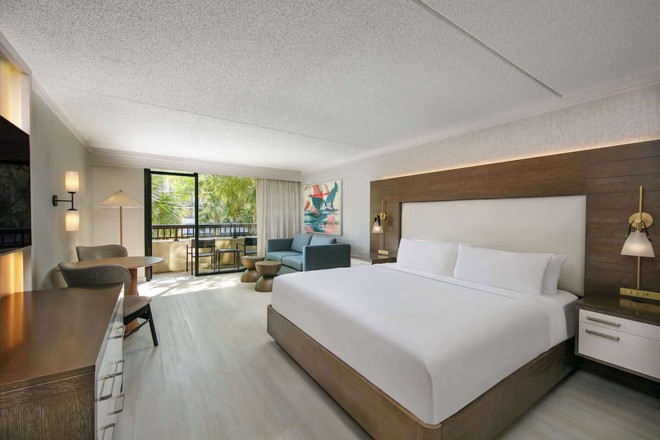 Lounge together in a modern suite with cozy seating.