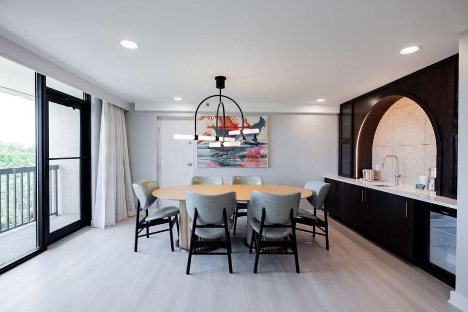 Gather for easy meals at the dining table beside the kitchenette