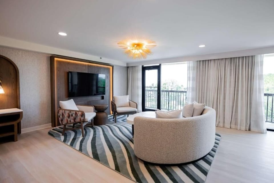 Unwind in the airy lounge with designer seating and soft light