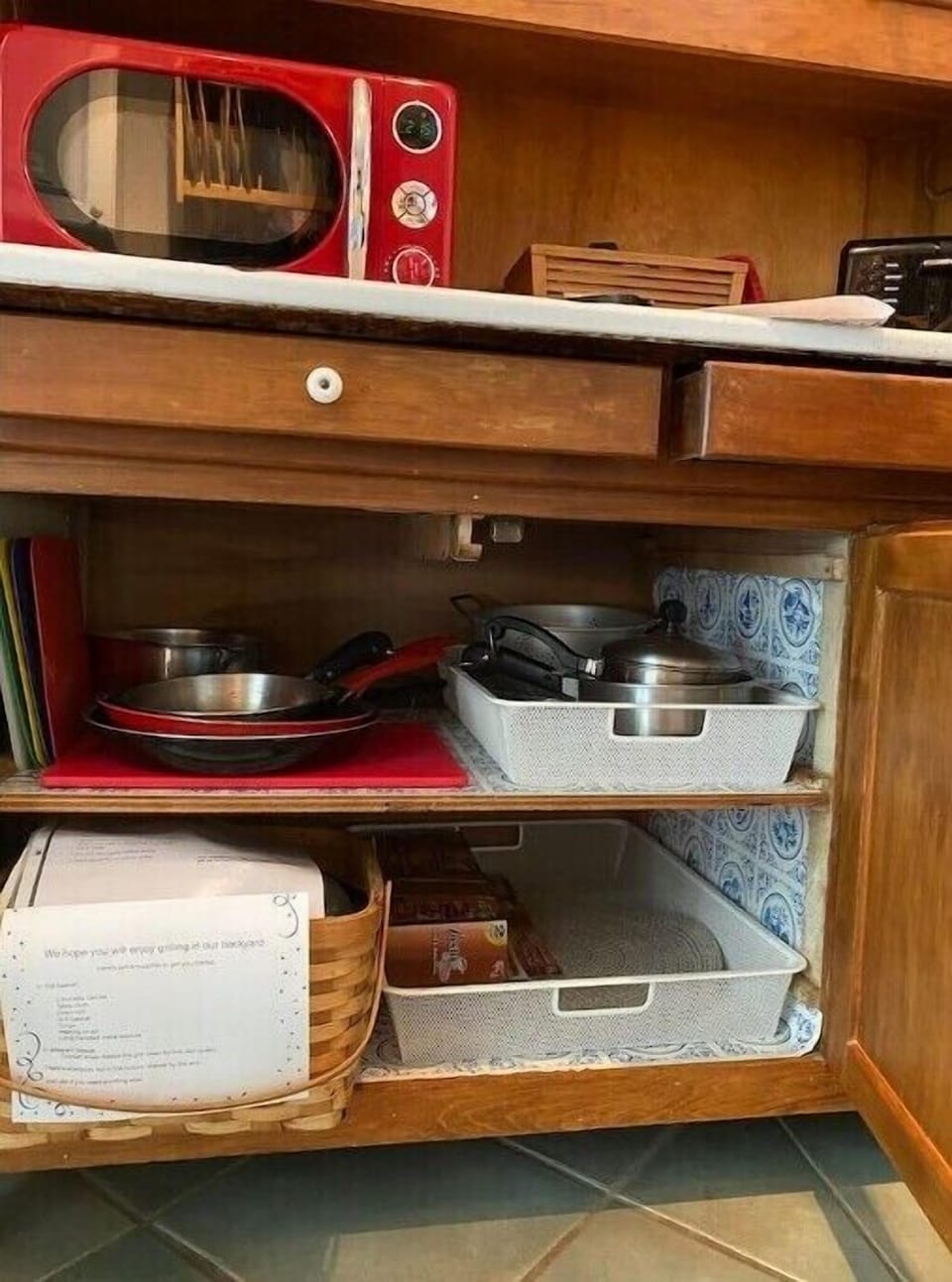 microwave, pots & pans, picnic basket with grilling supplies