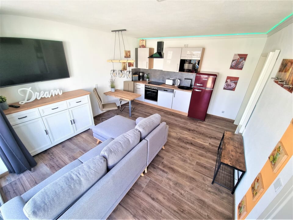 modern living, dining and kitchen area