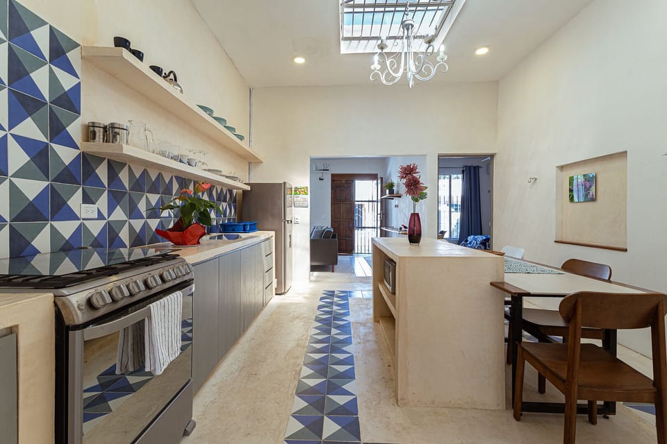 Spacious kitchen fully equipped for cooking, and dining area for 4 people.