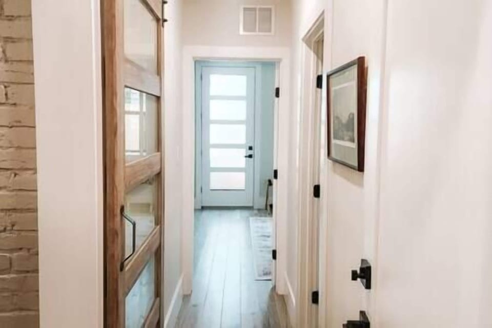 Private Hallway with Sliding Door to Kitchenette