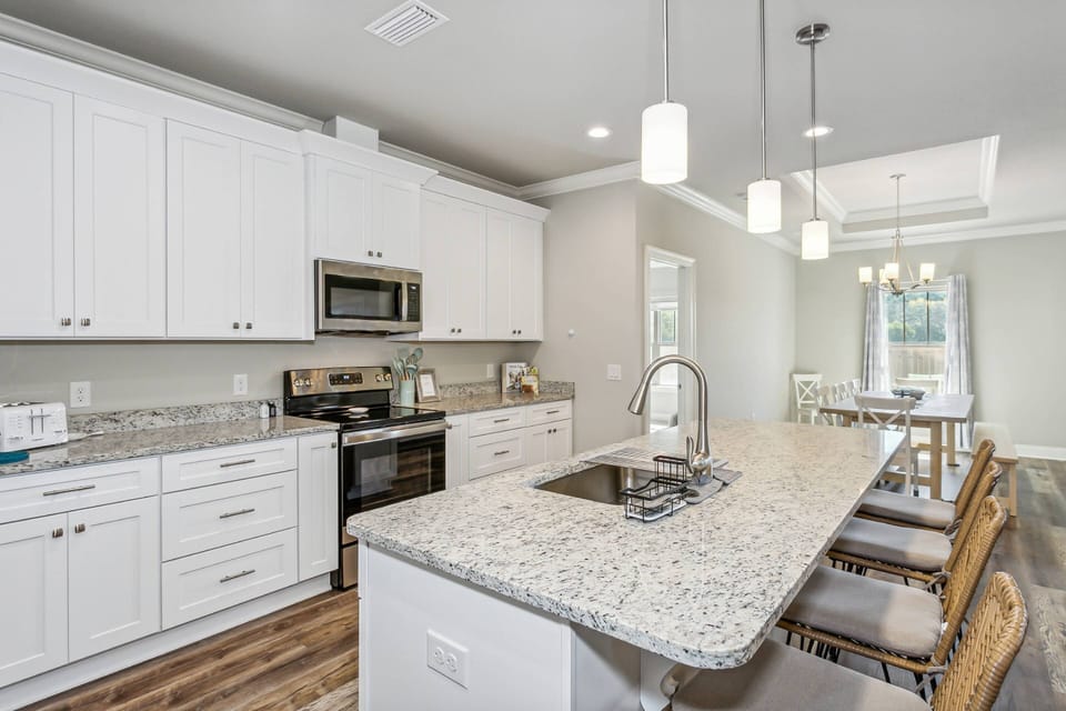 Large granite kitchen island with bar seating