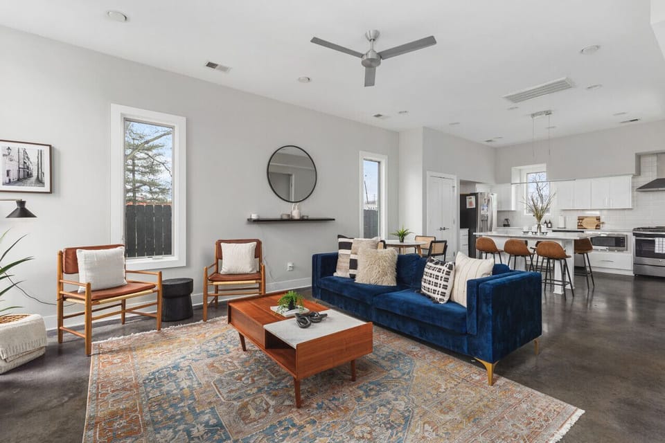 Spacious yet cozy living room with lots of natural light, a Smart TV, and plenty of seating.