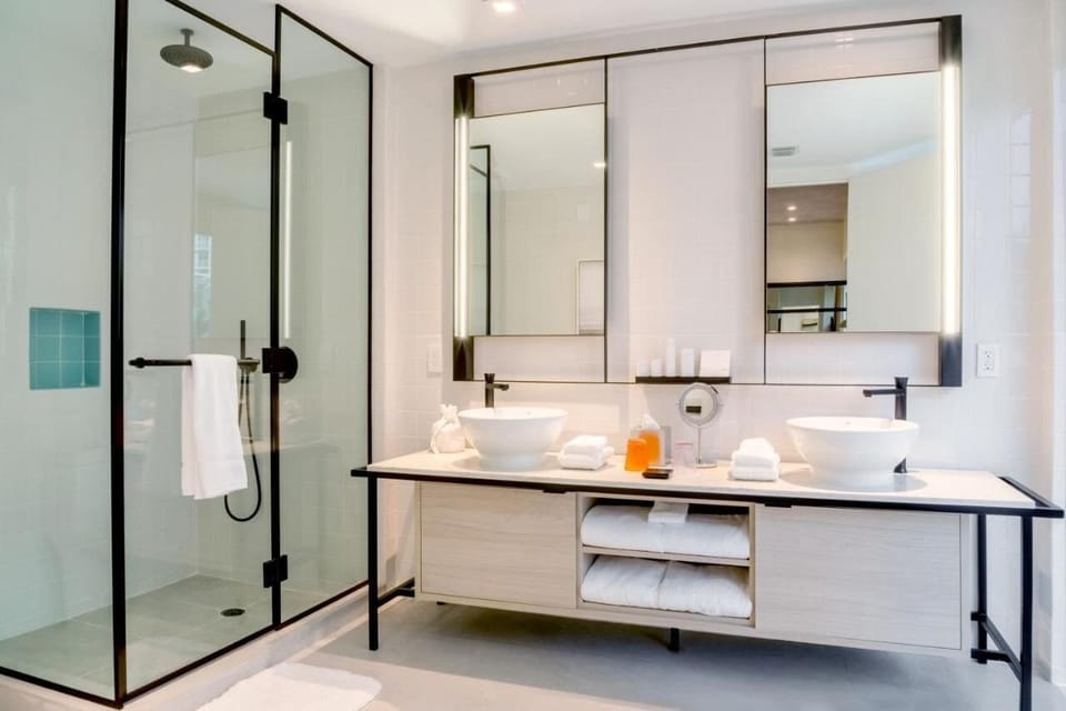 Refresh in a spa-like bath with double vanities and rain shower.