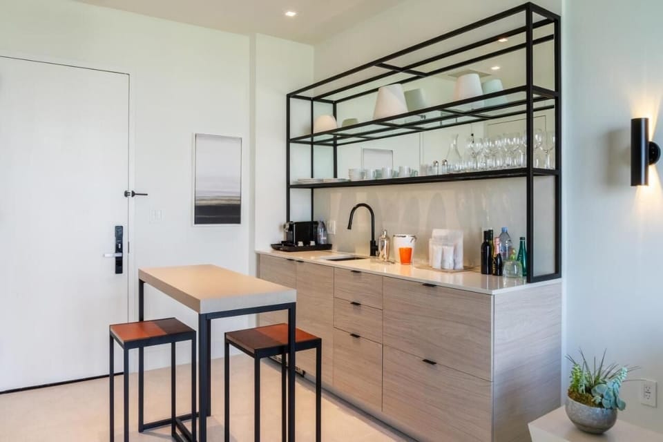 Mix cocktails and prep snacks at the sleek kitchenette bar