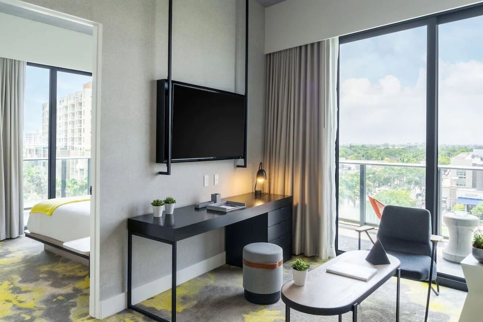 Settle in with a dedicated desk and breezy balcony access.