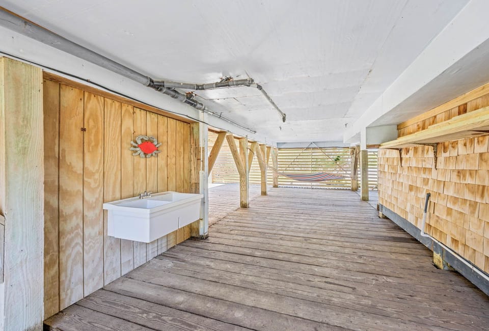 You'll love the gated area under the house to keep younger children, dogs, and your watersport equipment safe and secure.