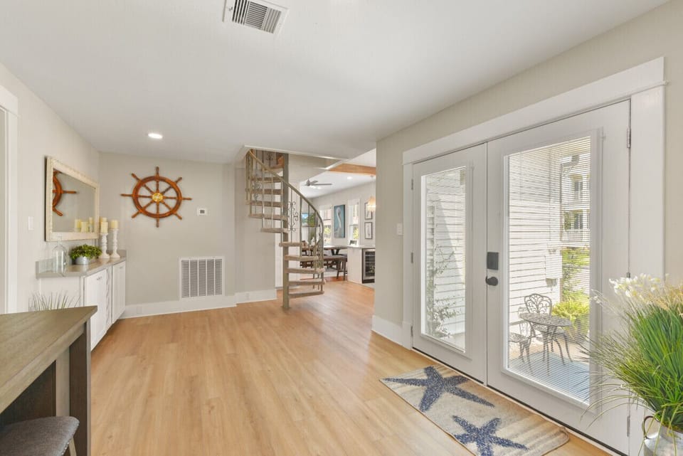 Bright Entryway by Driveway with French Doors and Open Flow to Living Areas
