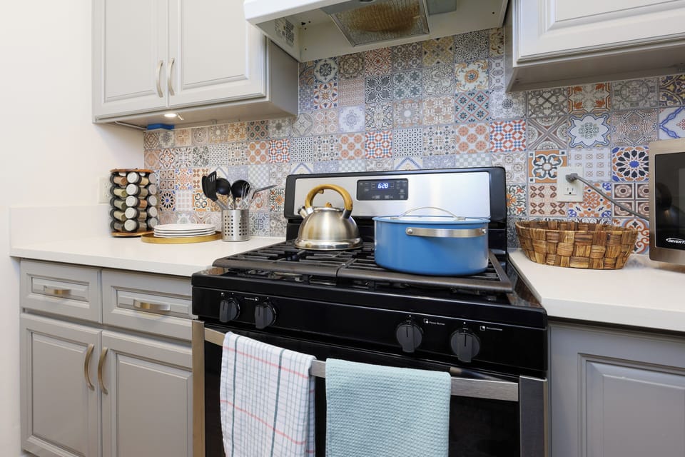 Step into a spotless, fully equipped kitchen ready for everything .