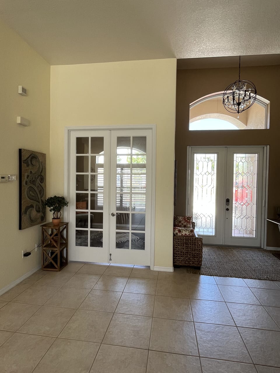 Spacious entry with 12 foot ceilings and 8 foot doors throughout. 