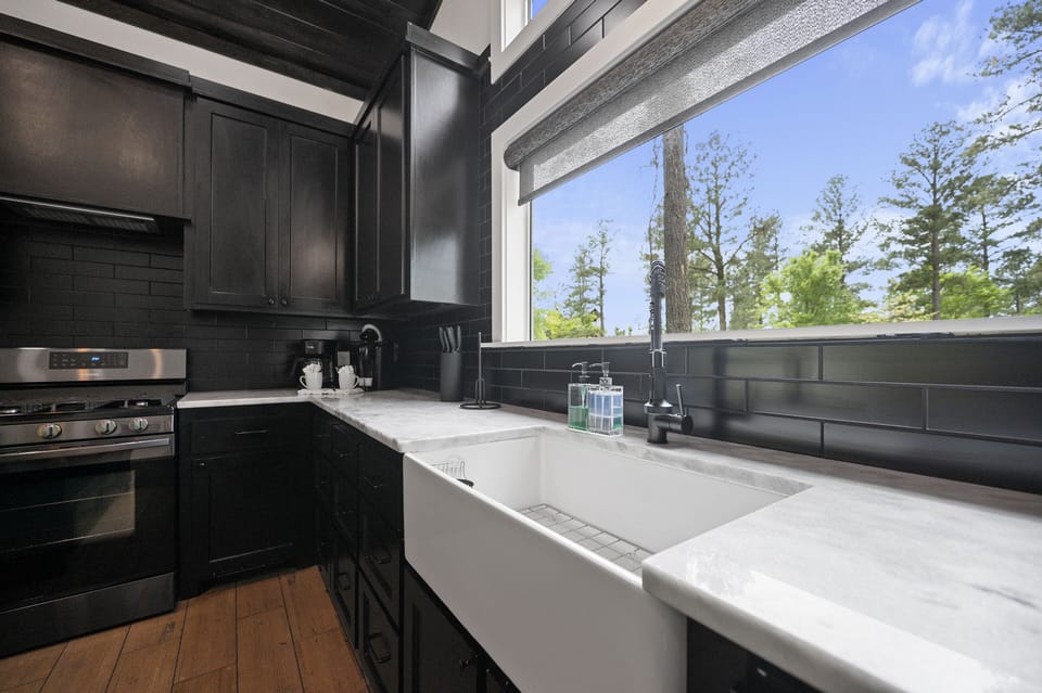 This large farmhouse sink has plenty of room for washing dishes...or to keep stacking them and just do them later...