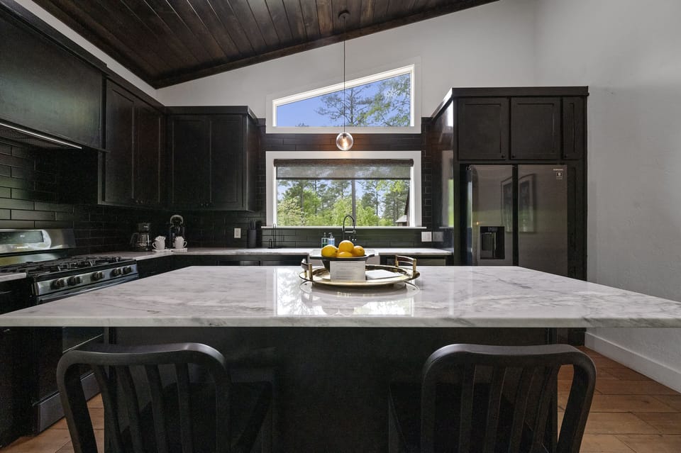 You'll love this huge kitchen island that gives plenty of prep space and doubles as additional dining seating.
