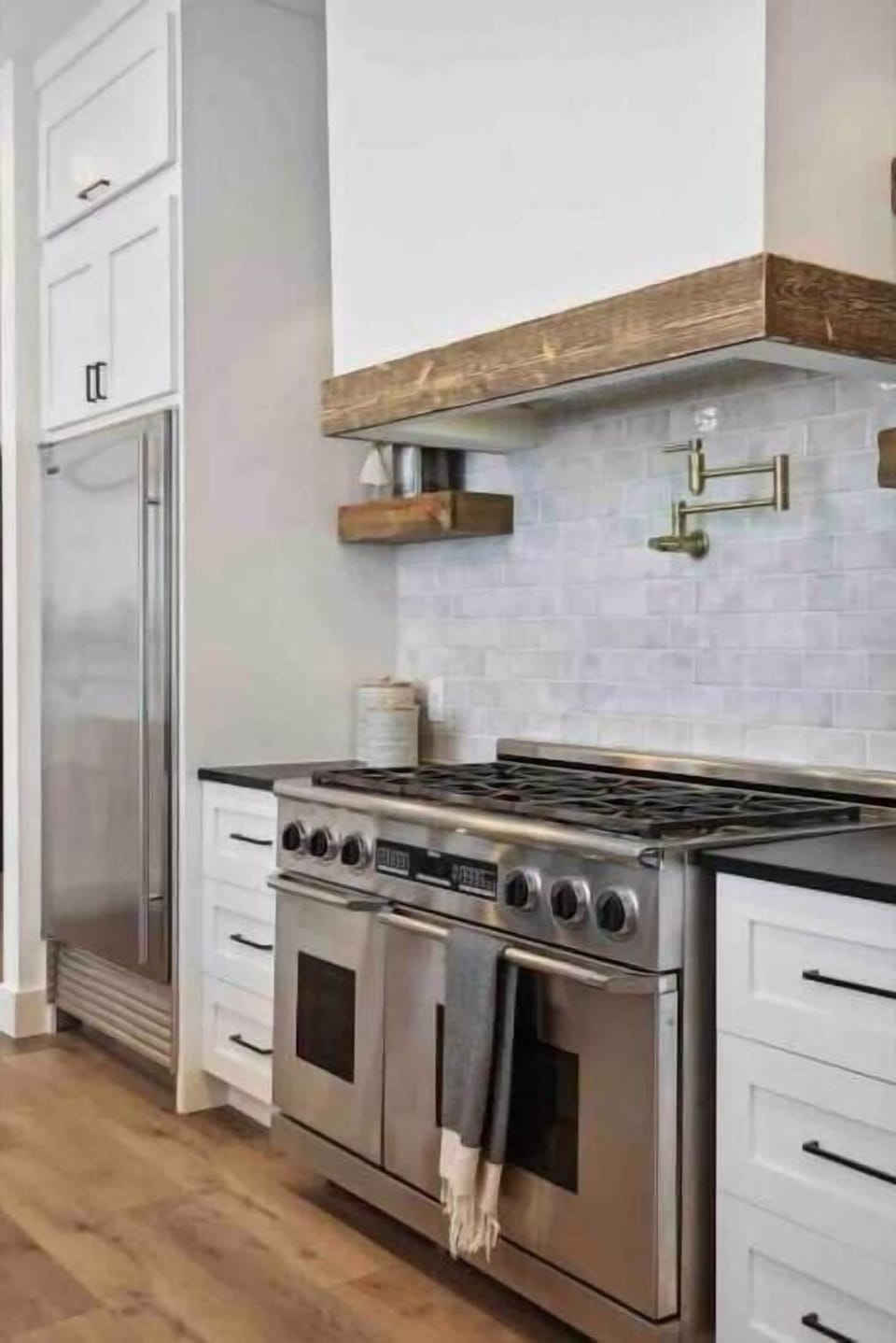 48" gas stove with double ovens.  Ovens have both bake and convection