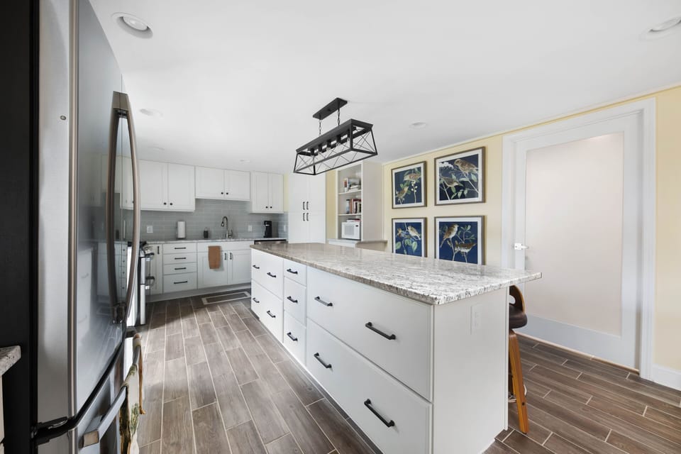 The eight-foot island is a great place to engage with activities of the kitchen