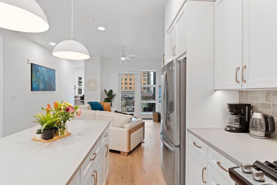 Open plan kitchen, living room and walk out patio are located on the main floor with a half bath and dedicated office space.