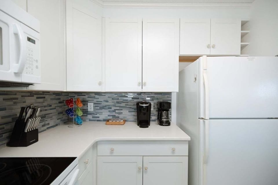 Newly renovated kitchen featuring Quartz countertops, modern appliances, and everything needed for cooking, entertaining, and hosting family meals.