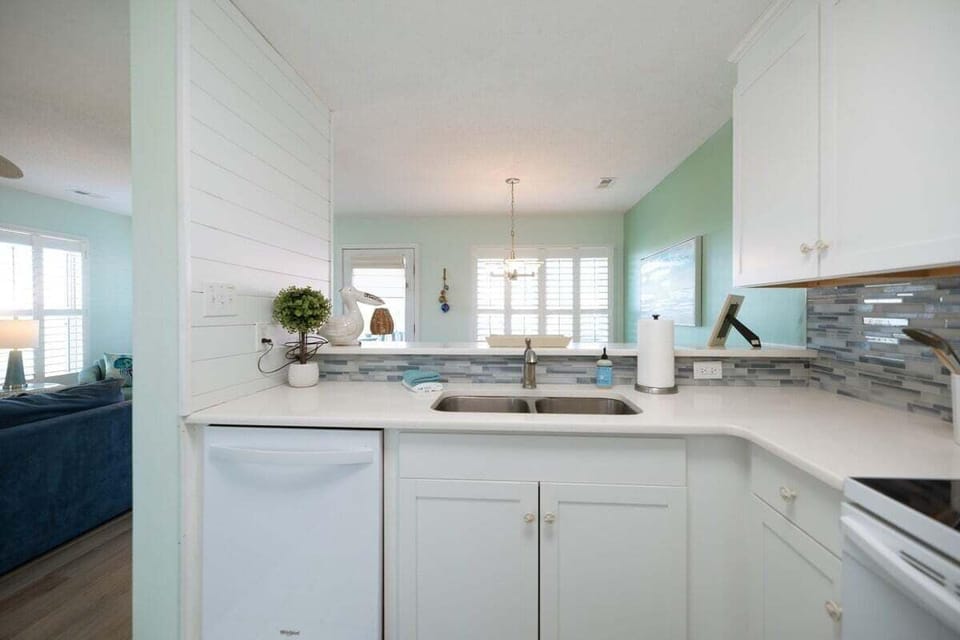 Newly renovated kitchen featuring Quartz countertops, modern appliances, and everything needed for cooking, entertaining, and hosting family meals.